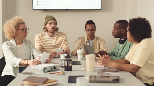 People Having a Discussion at a Meeting