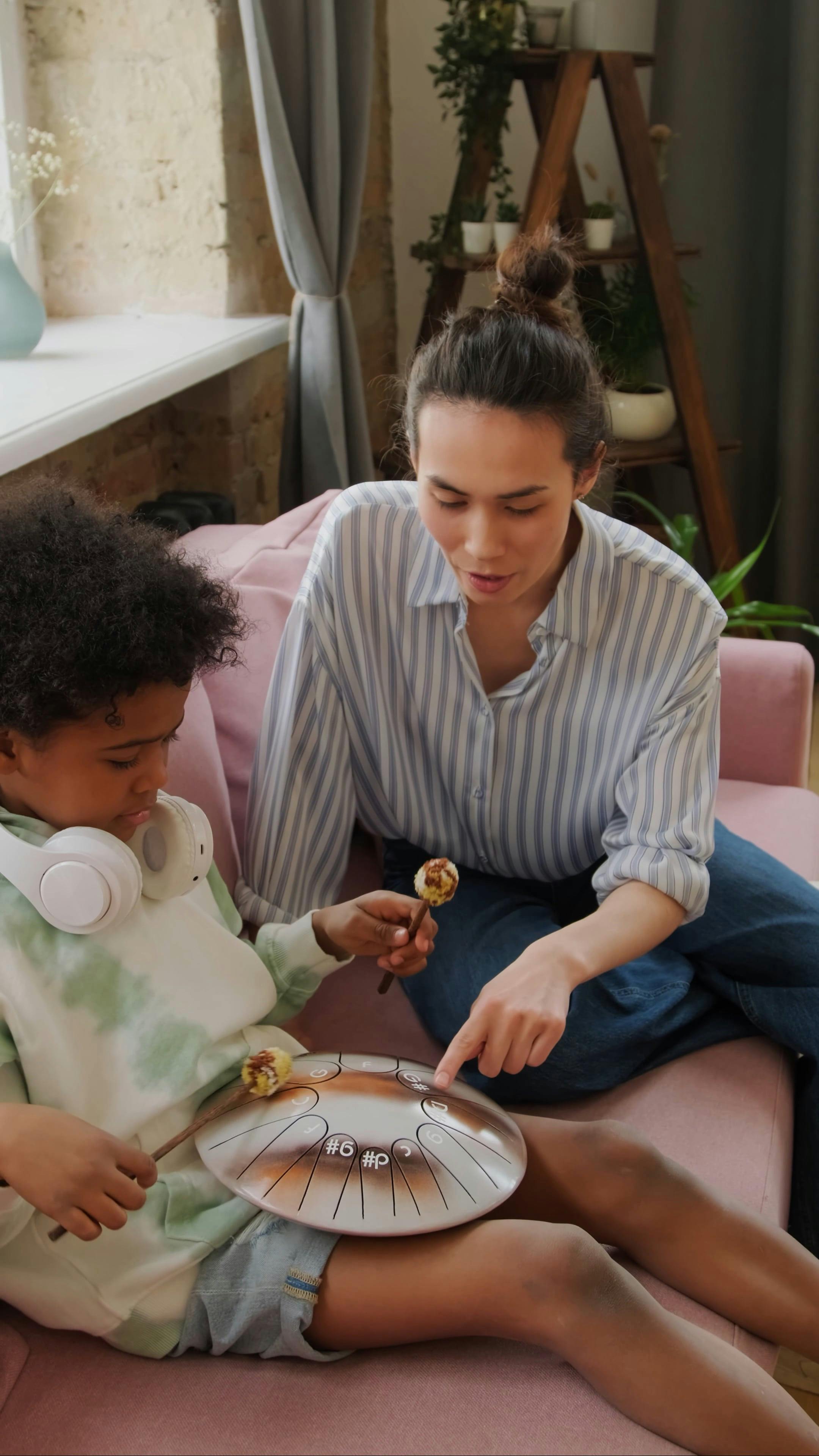 Young Boy Drumming while Teacher is Explaining Free Stock Video Footage