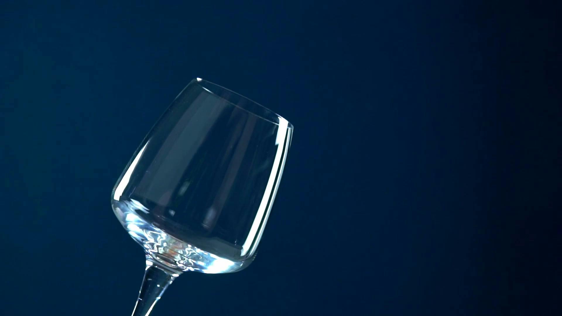 Pouring Water on a Wine Glass · Free Stock Video