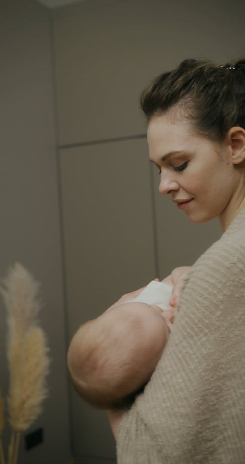 A Woman Breastfeeding Her Baby