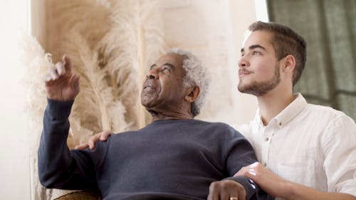 Men Looking by the Window