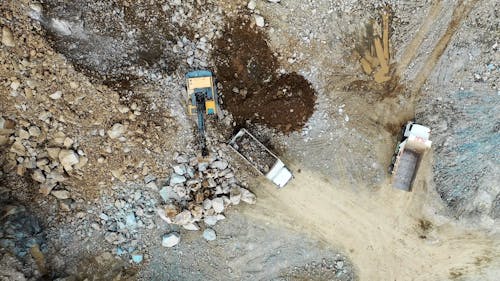 Aerial Footage of Trucks on a Construction Site