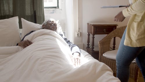 Woman Checking the Pulse of a Man