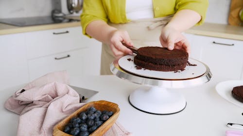 Woman Slicing a Cake