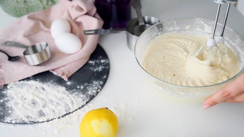 A Person Using a Hand Mixer