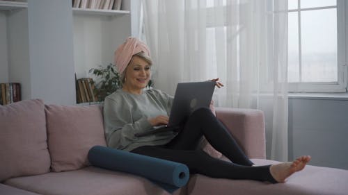 Elderly Woman Having a Video call on Her Laptop