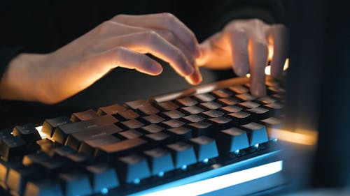 Person using Keyboard while Typing