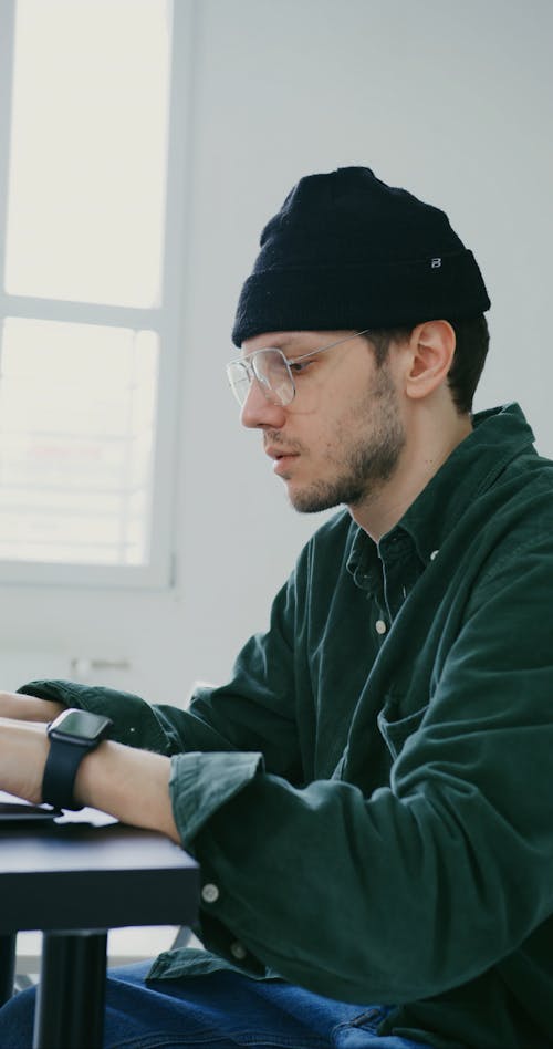 A Man Using His Laptop