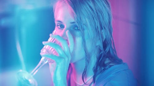 A Woman Drinking Using Wine Glass