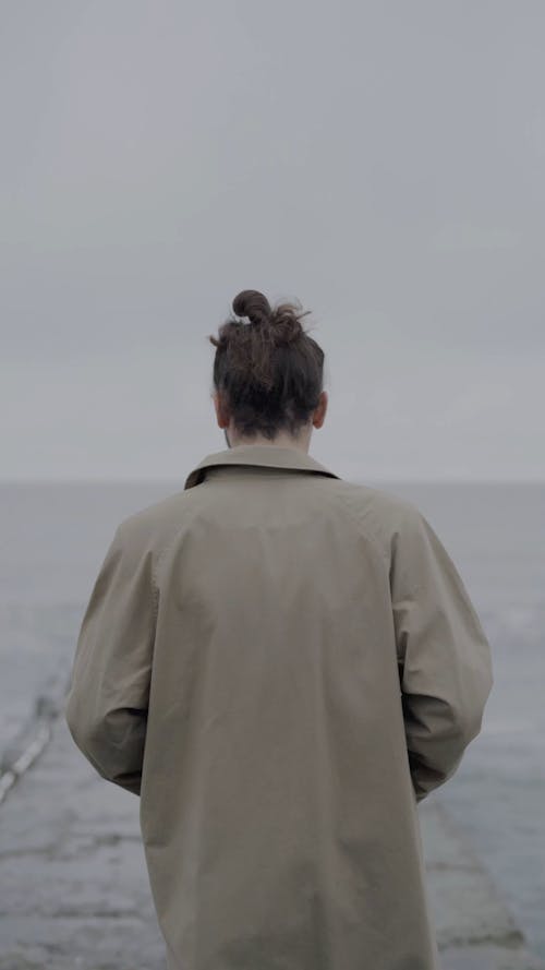 Man Walking on Sea Dock 