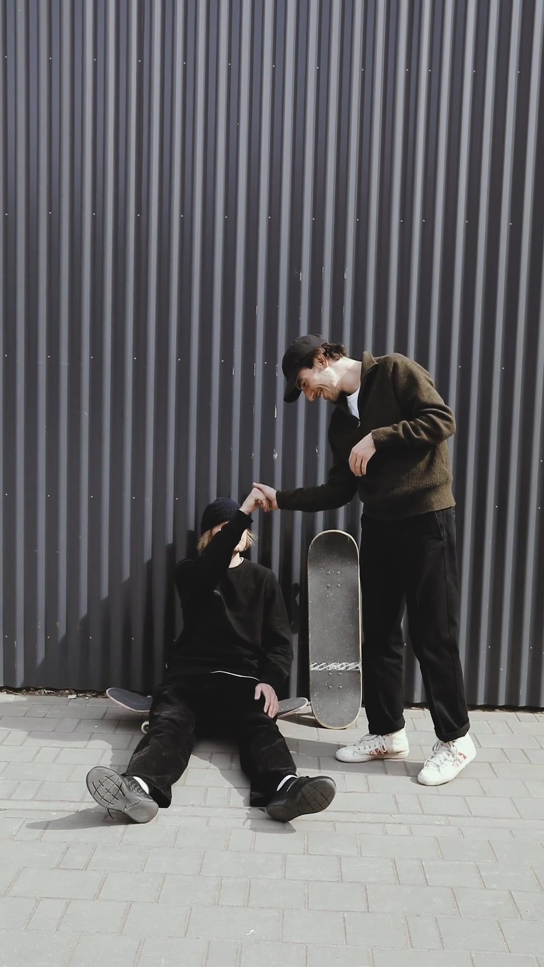 Skateboarders Doing Hand Gestures