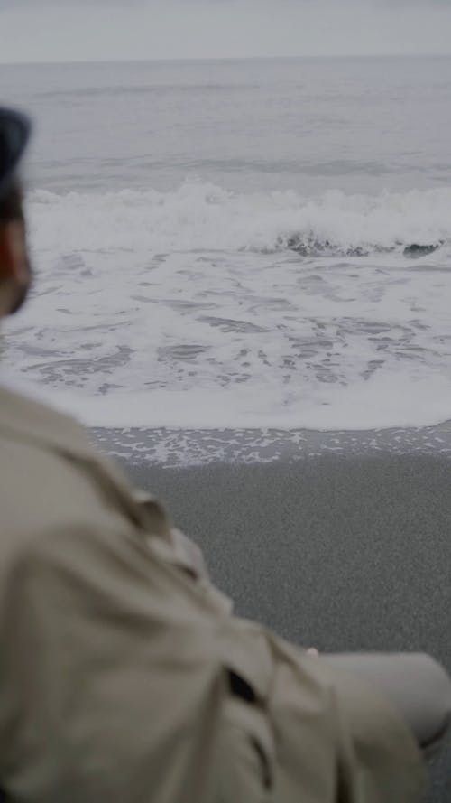 Lonely Man Sitting on Seaside