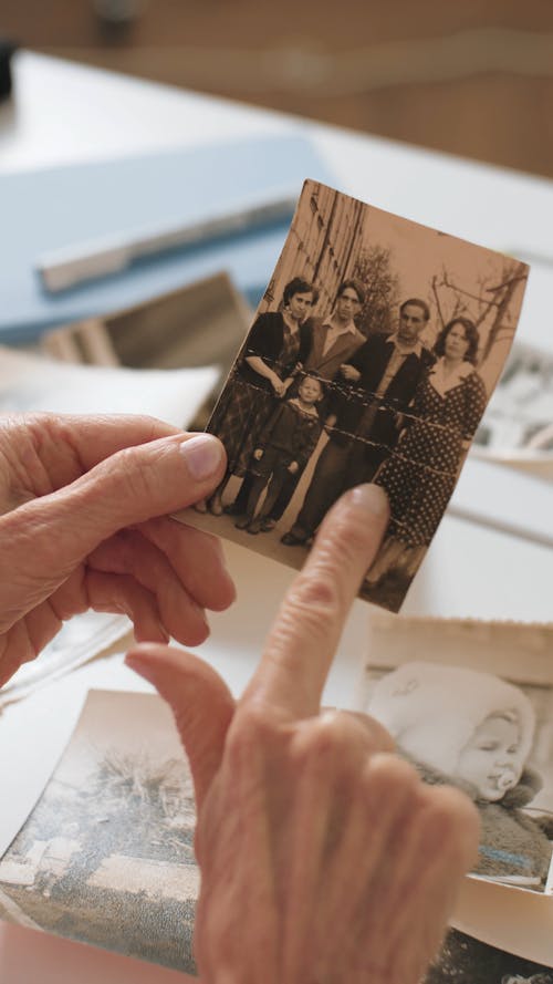 A Person Holding an Old Photo