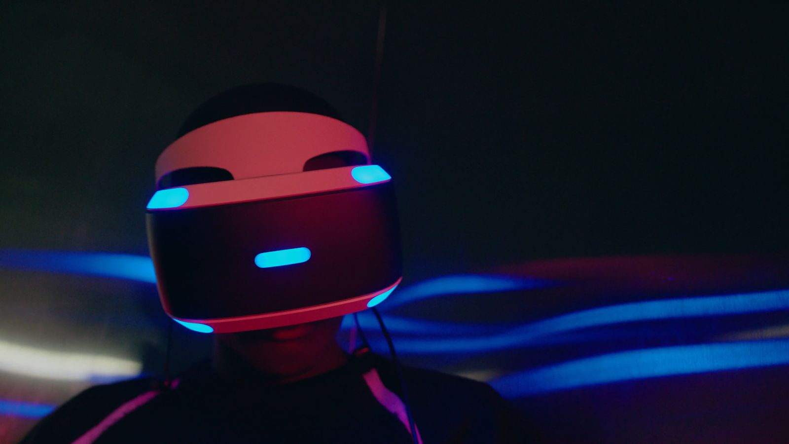 Player wearing a VR headset in a dark room