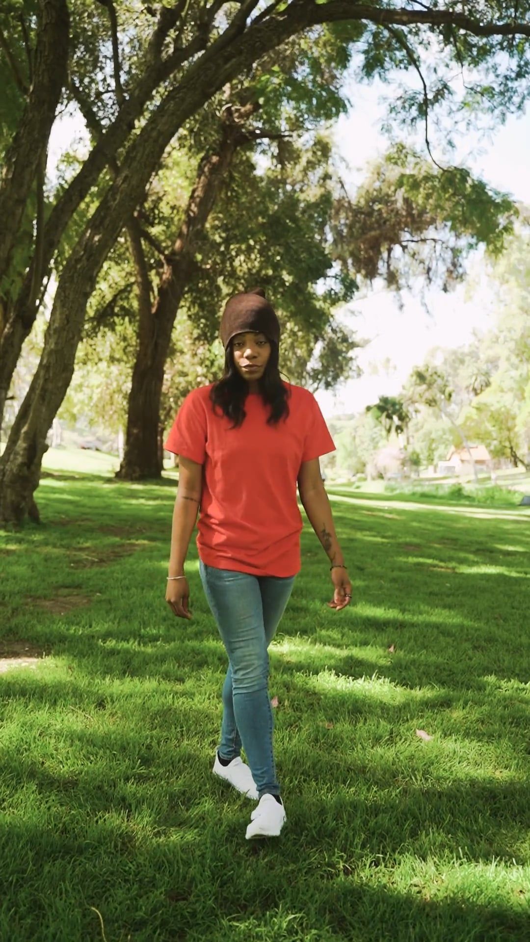 A Woman Standing and Posing in the Camera While at the Park · Free ...