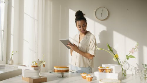 Business Woman using Tablet while Doing Inventory