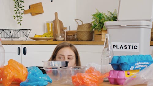 Woman Looking and Thinking with the Trash 