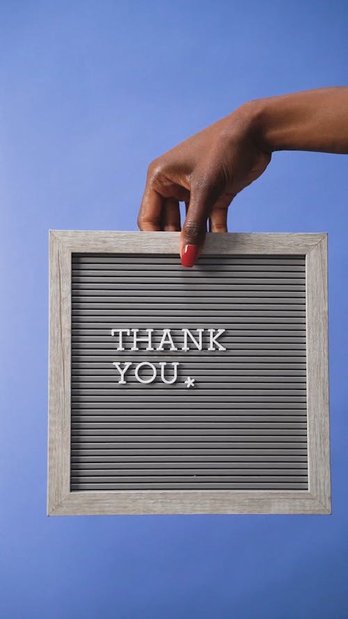 Person Holding a Letter Board