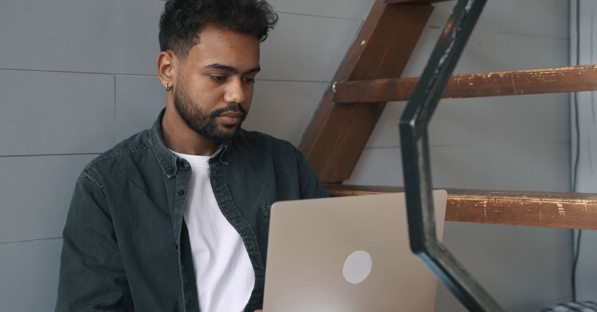 Man Using Computer 4k Man Using Laptop While Seated On Stairs Free Stock Video Footage ...
