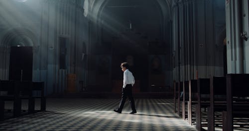 Boy inside of an Empty Church 