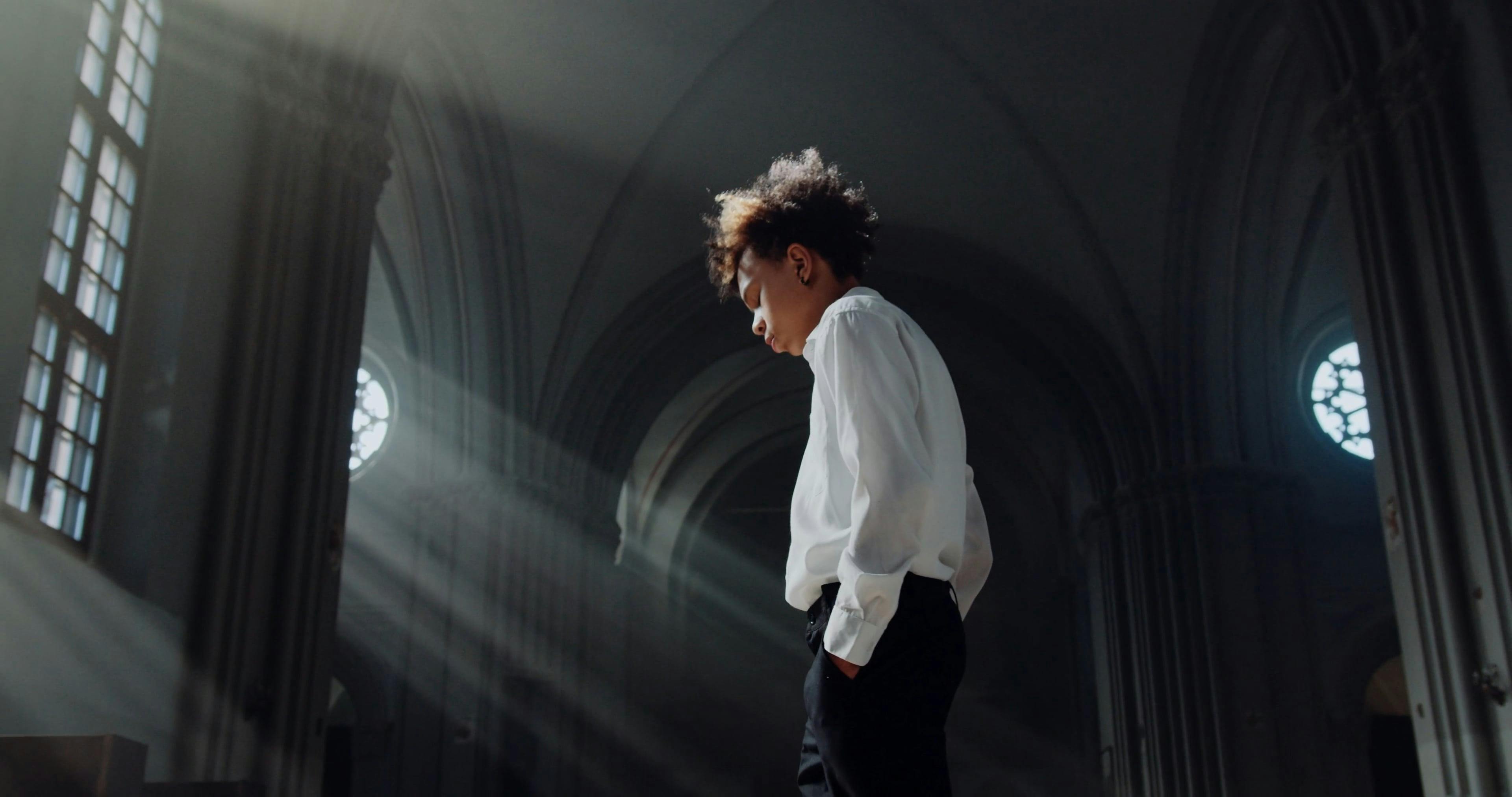 A Young Guy Walking Back and Forth in the Church · Free Stock Video