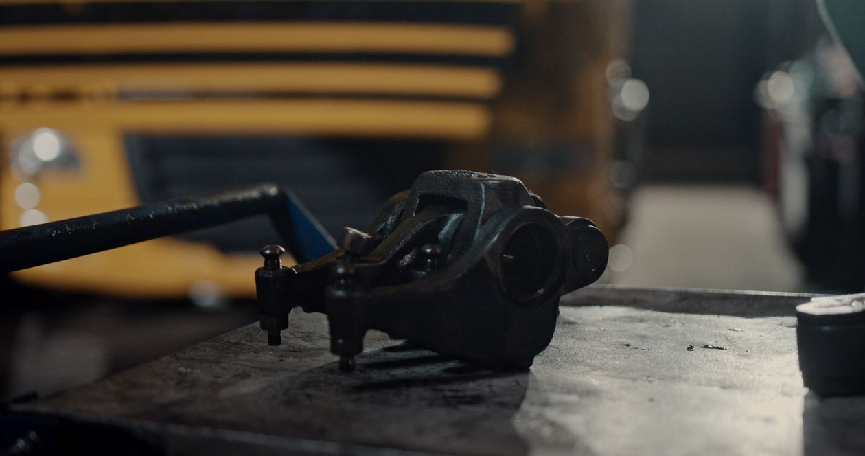 Mechanic working on engine components in a workshop