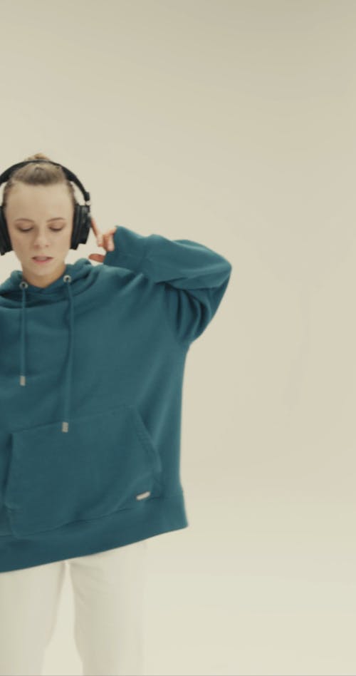 A Person Dancing while Listening to Music