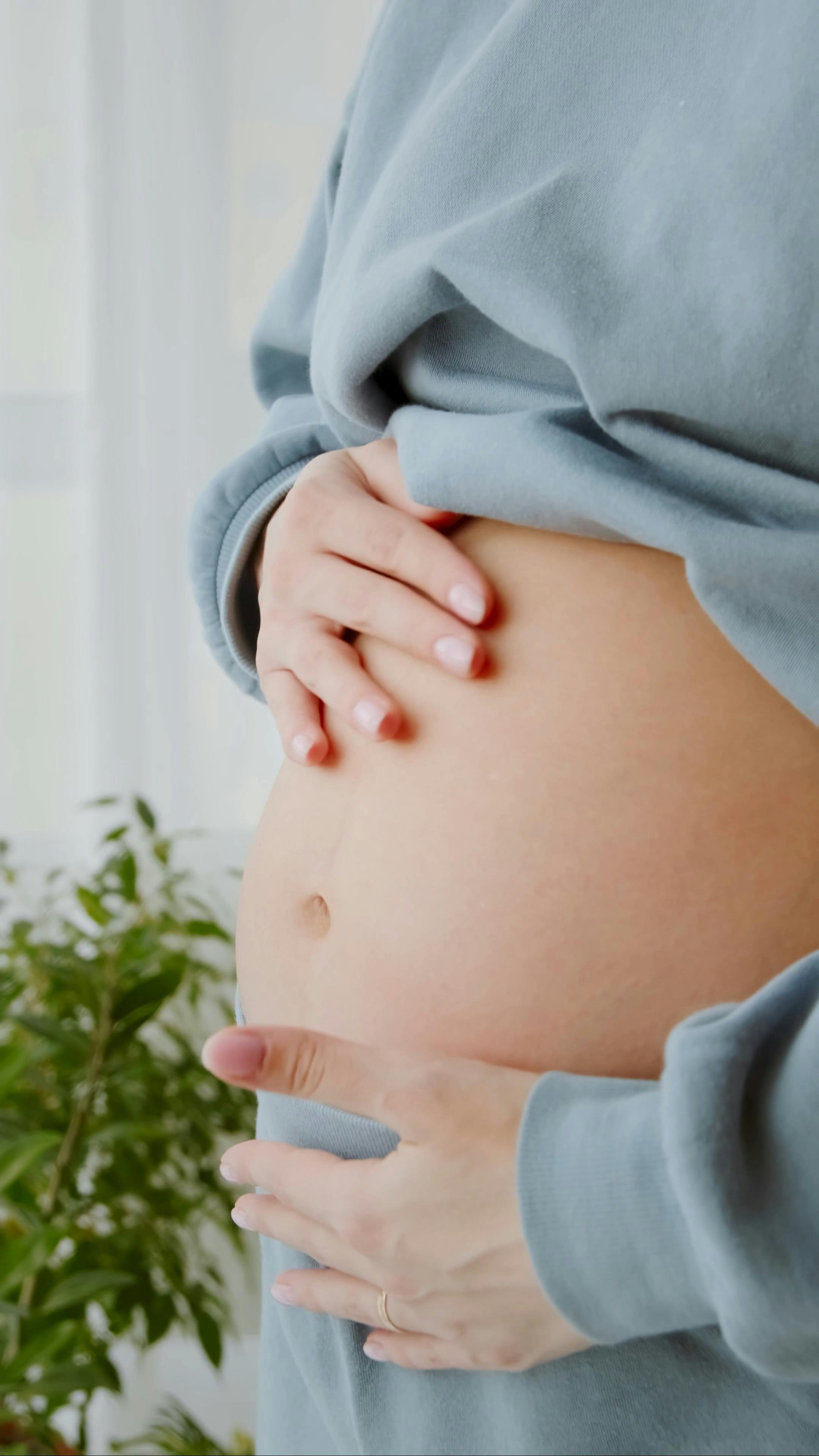 Woman Touching her Baby Bump · Free Stock Video