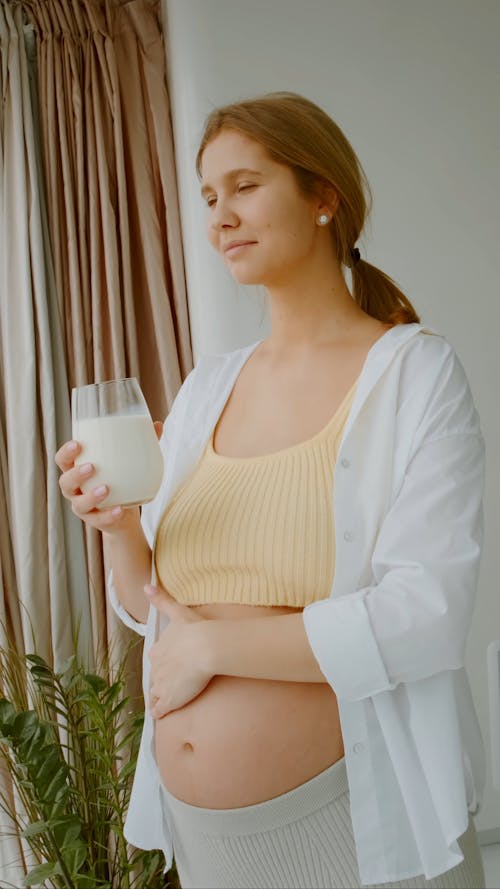 Pregnant Woman Touching Her Belly