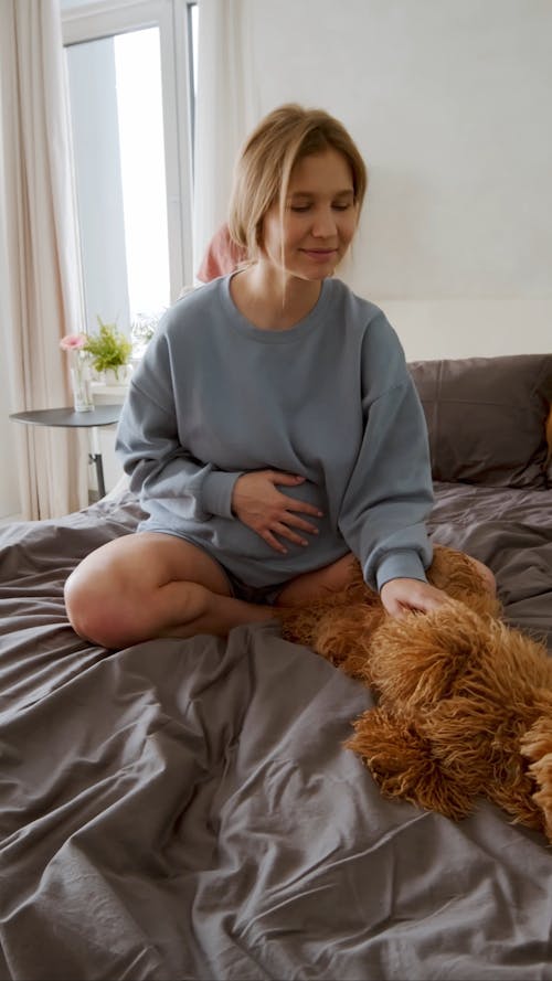 Woman Caressing A Dog