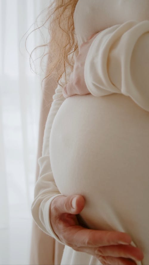 Pregnant Woman Caressing Belly