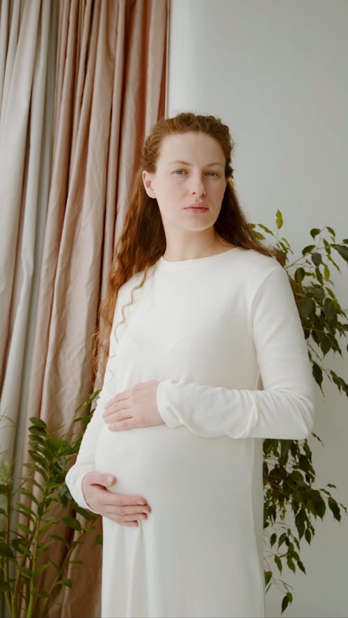 A Pregnant Woman Holding Her Baby Bump
