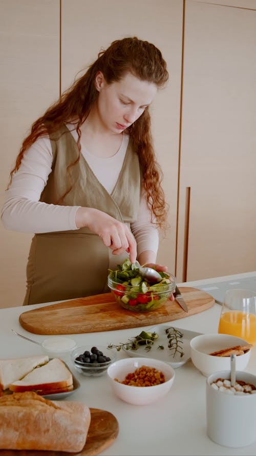 Pregnant Woman Mixing Salad