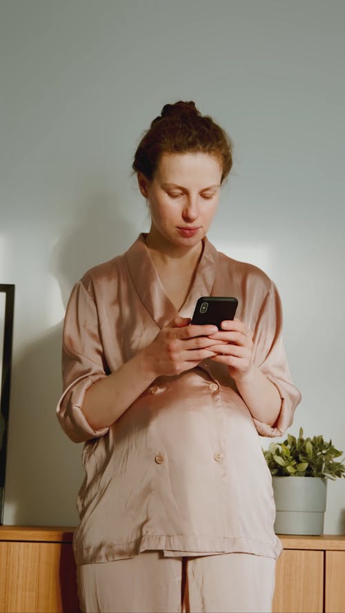Pregnant Using Mobile Phone