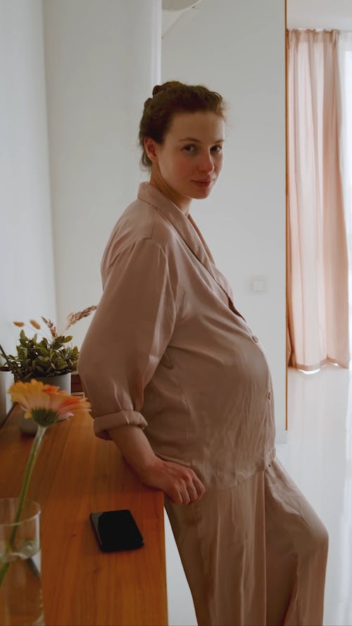 A Pregnant Woman Looking at Camera