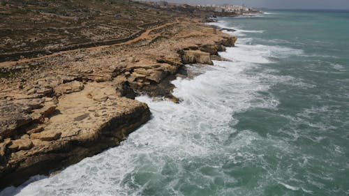 Sea Waves Crashing Through a Rocky Shore