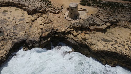 Drone Shot of Rocky Cliff by the Sea