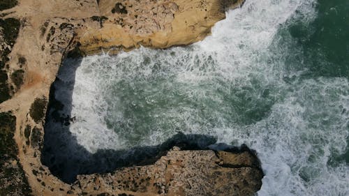 Sea Waves Crashing Through a Rocky Shore