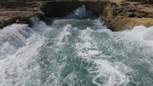 Sea Waves Crashing Through a Rocky Shore