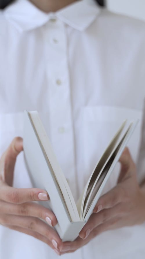 Person Holding Book