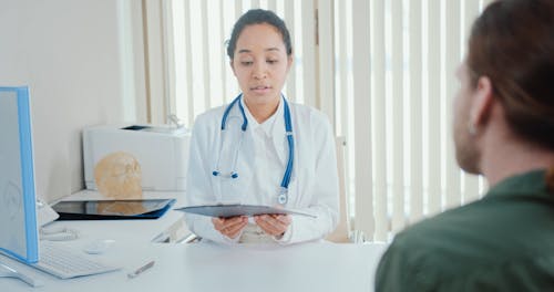 A Doctor Showing a Coronavirus Test Result