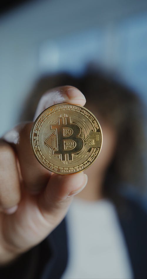 Woman Holding a Bitcoin 