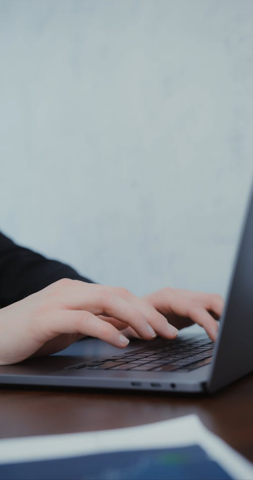 Person using Laptop while working