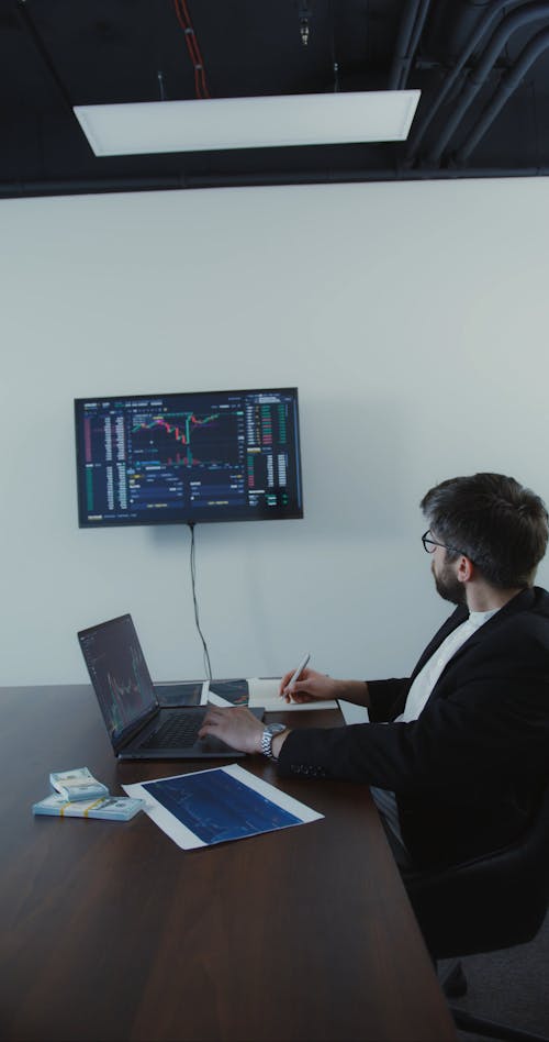 Man Monitoring the Stocks