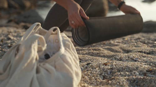 Woman Preparing the Yoga Mat 