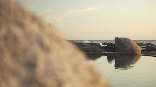 Woman Doing Yoga Over A Rock