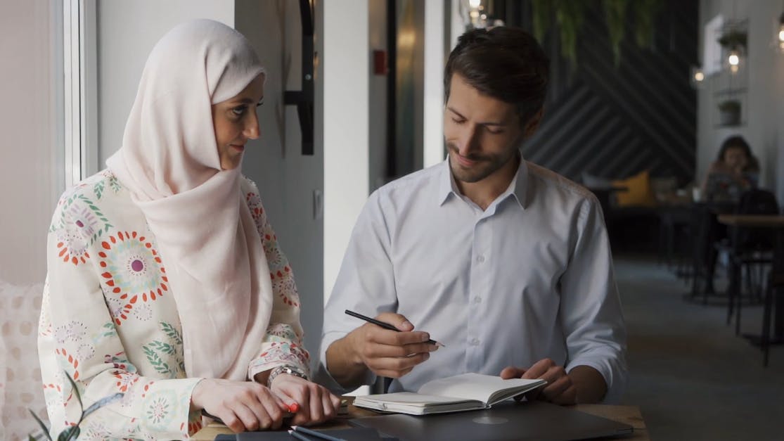 A Teacher Teaching a Hijab Woman · Free Stock Video