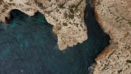 Drone Footage of a Sea and a Rock Formation