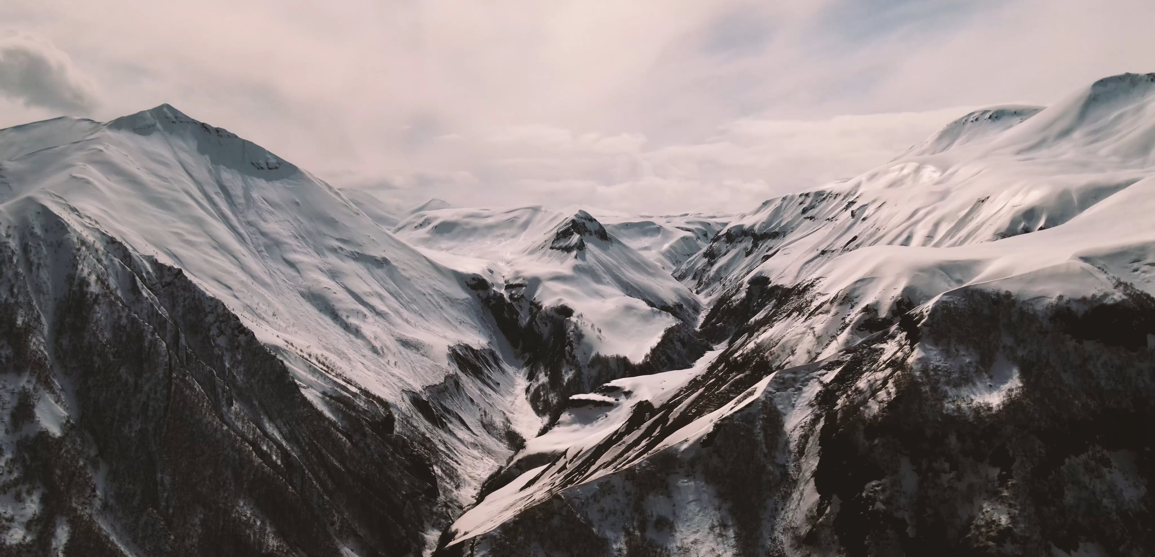 Scenic Drone Footage of a Mountain Covered in Snow Free Stock Video ...