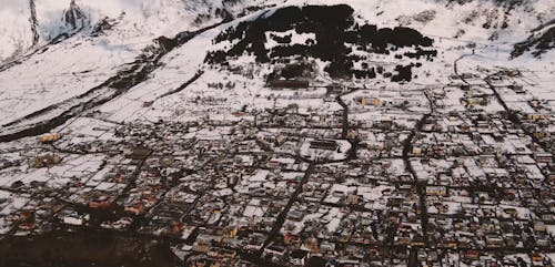 Tilt Shot of the Snow Covered Mountain Area